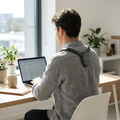 Smart posture corrector worn at a desk